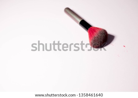 Brush for makeup on pink background
