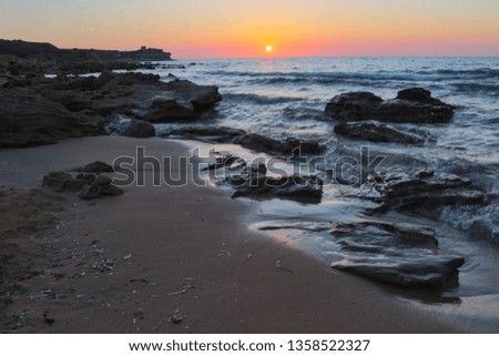 Charming sunset on the beach called Spiaggia di Porto Ferro. This beautiful sandy beach is located in northwest part of Sardinia. Rocks, sand and historical ruins gives You amazing views. 