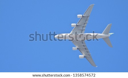 Extreme zoom photo of large passenger Air Plane flying in clear blue sky