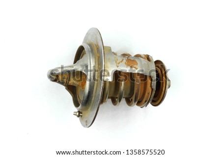 Car Thermostat , old thermostat, engine thermostat valve. Auto part, elements of the engine cooling system isolated on white background