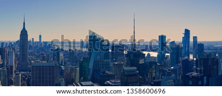A panoramic view of the Manhattan skyline in New York during sunset