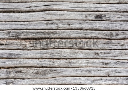 old log wall, texture of antique wooden logs, close up decor abstract background