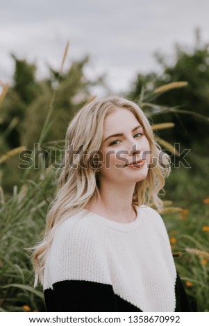 Beautiful Attractive Blond Hair Young Fair Skinned Caucasian Woman with Pretty Smile in Nature for Headshot Portraits Outside