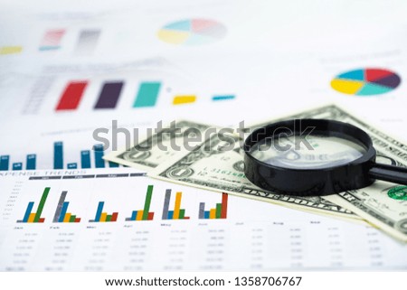 Magnifying glass and US dollar banknotes background : Banking Account, Investment Analytic research data economy, trading, Business company concept.
