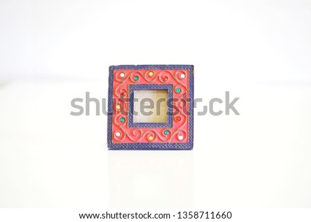 Selective focus on picture frame isolated on white background