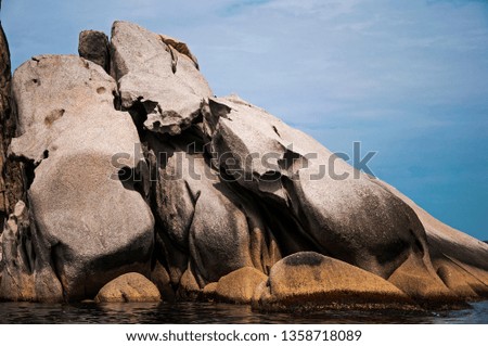 color photo of sea stones of strange abstract shape