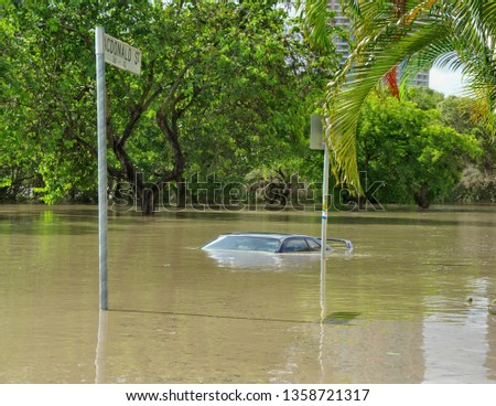 The 2010-11 Brisbane floods caused a lot of damage. Here a car is submerged in deep floodwater in Kangaroo Point, Brisbane