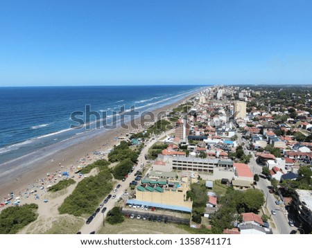 Photo taken by a drone over the sea and the town of San Bernardo, on the Argentine coast. The picture was taken during the summer.