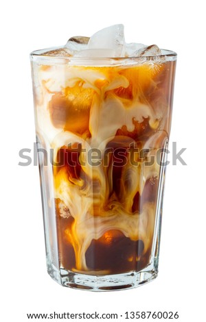 Ice coffee in a tall glass with cream poured over and coffee beans. Cold summer drink on a light background. Royalty-Free Stock Photo #1358760026