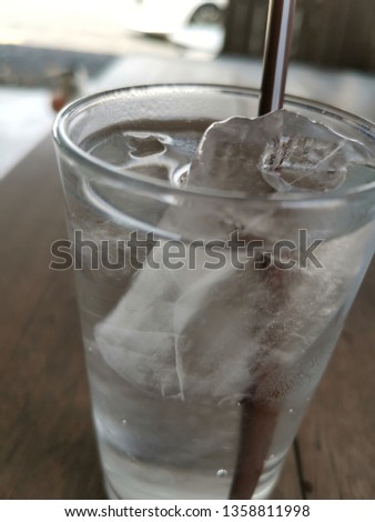 Glass of water with ice isolated on white background 