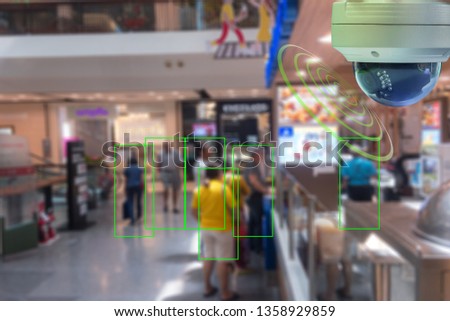A Dome CCTV  infrared camera  technology 4.0 for look security area of people at shopping mall show signage with checking and courting people in green boxed security area Royalty-Free Stock Photo #1358929859