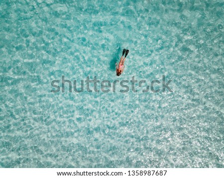 Female snorkeler in turquoise waters