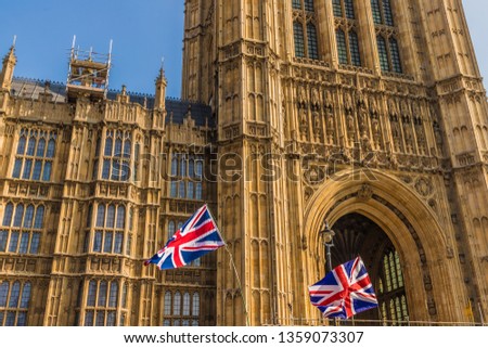 March 29 2019. London. Union flags flying by parliament in parliament square London Royalty-Free Stock Photo #1359073307