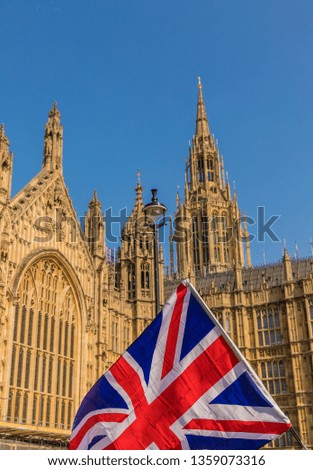 March 29 2019. London. Union flags flying by parliament in parliament square London Royalty-Free Stock Photo #1359073316
