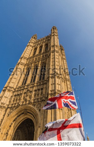 March 29 2019. London. Union flags flying by parliament in parliament square London Royalty-Free Stock Photo #1359073322