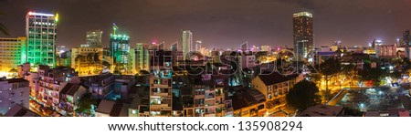 panorama, night lights of Saigon and road traffic along the streets