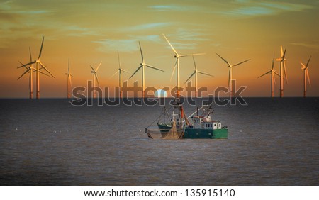 fishing boat and wind turbines Royalty-Free Stock Photo #135915140