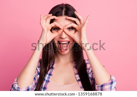 Close up photo amazing beautiful her she lady hold arm hand fingers okey symbol near brown eyes playful mood tongue out mouth wear casual checkered plaid shirt clothes outfit isolated pink background
