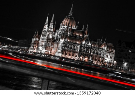 An abstract picture of the Hungarian Parliamentwith the lights of teh cars