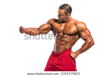 Body Builder Flexing Muscles Royalty-Free Stock Photo #1359179822