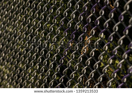 Closeup chain link texture with detail against an urban background abstract background.