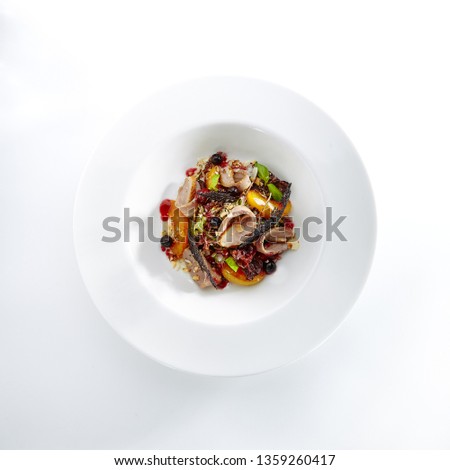 Duck Breast Salad with Bonfire Aroma and Warm Peach on Elegant Restaurant Plate Isolated on White Background. Poultry Meat with Berries and Nuts Serving in High Kitchen Style Top View