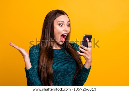 Close up photo beautiful amazing her she lady hold arms hands telephone make take selfies observe check all pictures yell cool quality wear green knitted pullover jumper isolated yellow background