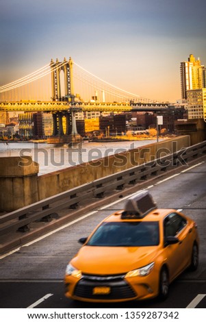 Yellow cab on the Brooklyn Bridge in New York City