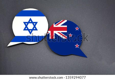 Israel and New Zealand flags with two speech bubbles on dark gray background