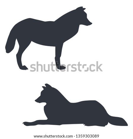 Silhouettes of standing and lying arctic wolves isolated on white background. Vector illustration EPS 8