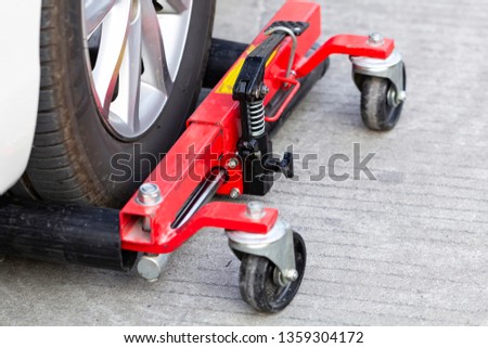 Cars wheel locked at parking line, concept of traffic violation rules, selective focus