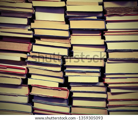 background of many book with vintage old toned effect in the library