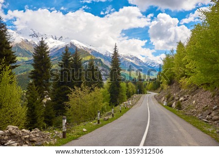 Road in the mountains of Svaneti under the blue sky