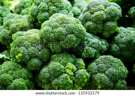 Group of fresh broccoli close up. Royalty-Free Stock Photo #135932579