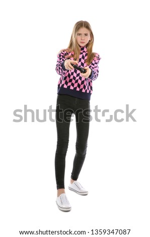 Teenage girl playing video games with controller isolated on white
