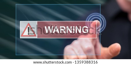 Man touching a warning concept on a touch screen with his finger