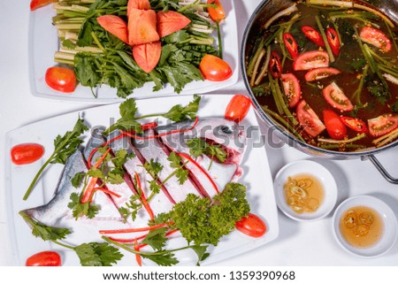 sour fish hotpot on white background 