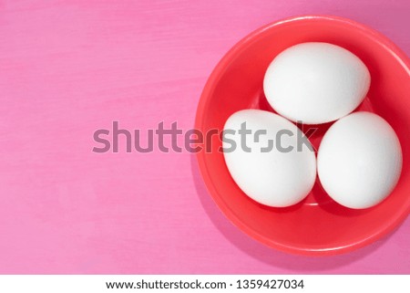 White eggs on colorful background
