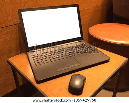 Laptop (screen has clipping path) on the table