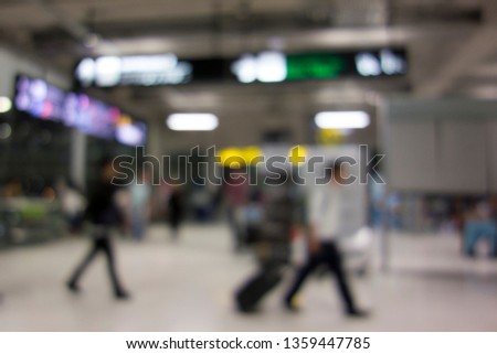 blur the traveler walking in the gate at the International Airport. Blur background Tourist walking with the bag at the Airport. 