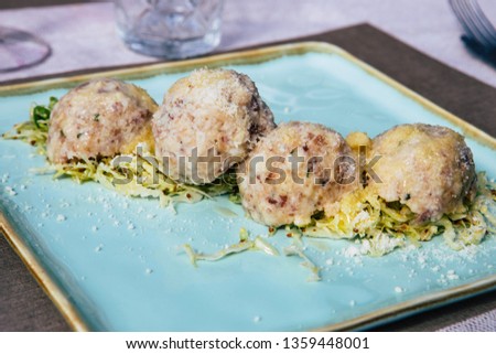Picture of a plate of Canederli, a typical italian pasta made with bread, Cortina D'Ampezzo, Italy