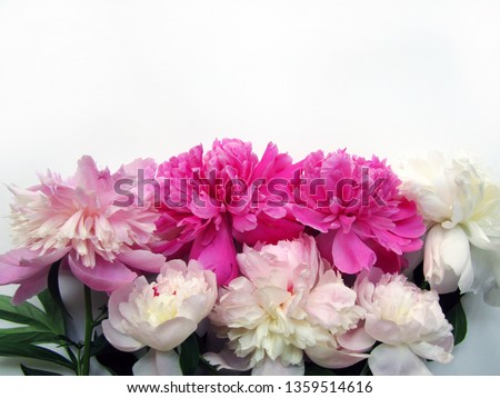 Mock up with pink and white flowers on a white table.    