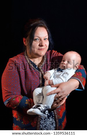 Proud Grandmother Holding Baby Grandson