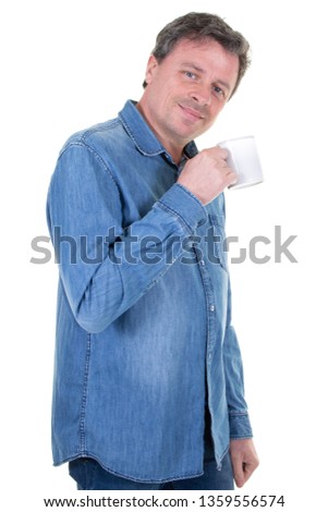 Pleasant man with cup of coffee and smiling at the camera while posing isolated on a white background