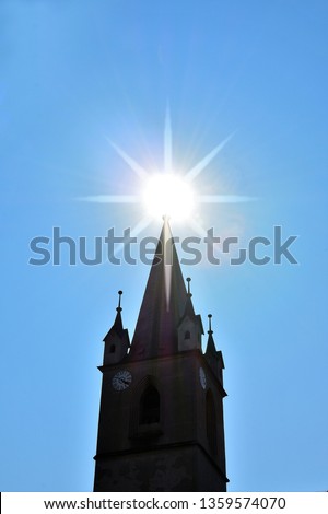 the sun on the top of the church