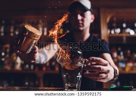 Fire ice cocktail with mint and cinnamon. Royalty-Free Stock Photo #1359592175