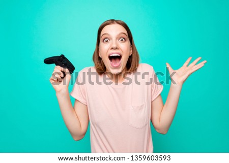 Close up photo beautiful amazing her she model lady open mouth big eyes yelling loudly best win celebration raised hands palms arms joystick wear casual t-shirt isolated teal turquoise background