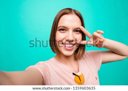 Close up photo beautiful her she lady modern look show v-sign near eye say hi short straight hair make take selfies instagram post followers wear casual t-shirt isolated teal turquoise background