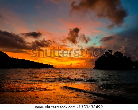 sunset sky in bali with shore sillhoute