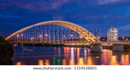 Bridge over the river with city lights in background night time picture